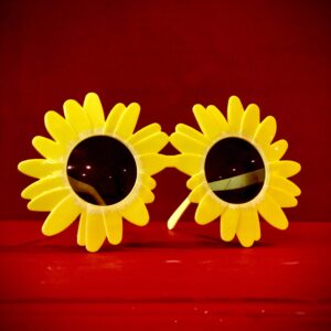 Official Art the Clown Sunflower Sunglasses with yellow floral petals and dark UV lenses - Terrifier Merch